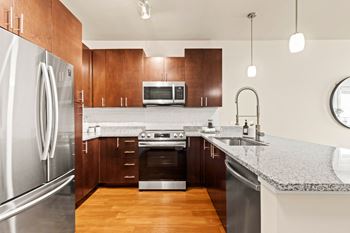 Tile kitchen backsplash (in select units)